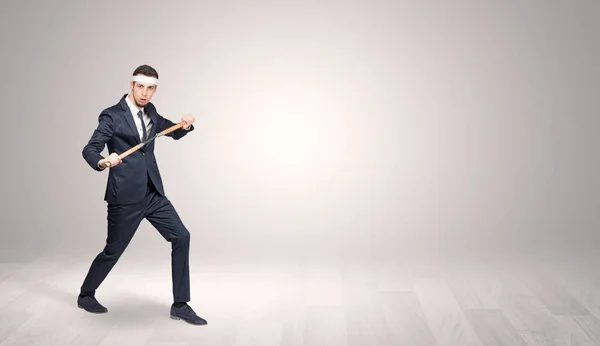 Businessman fighting in an empty space — Stock Photo, Image