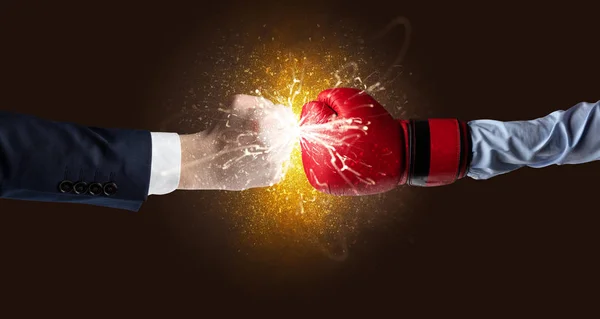 Fighting hands with orange explosion concept — Stock Photo, Image