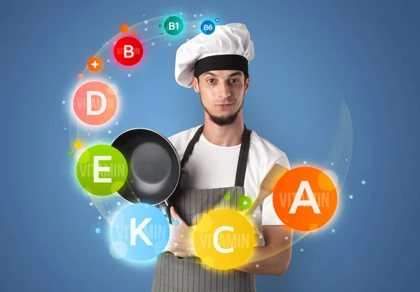 Handsome cook with vitamin concept — Stock Photo, Image