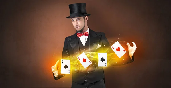 Illusionist making trick with magical play cards — Stock Photo, Image