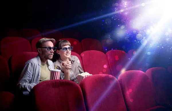 Romantic couple sitting at spectacle — Stock Photo, Image