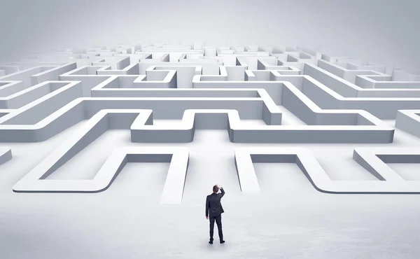 Businessman starting a flat 3d labyrinth — Stock Photo, Image