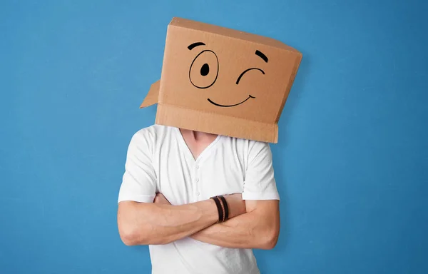 Man with smiling carton box head — Stock Photo, Image