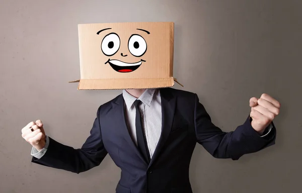 Young boy with happy cardboard box face — Stock Photo, Image