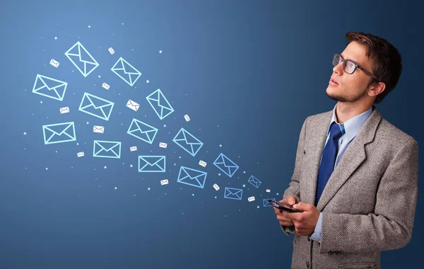 Businessman using phone with mail concept around — Stock Photo, Image