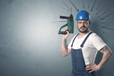 Worker standing with tool. clipart