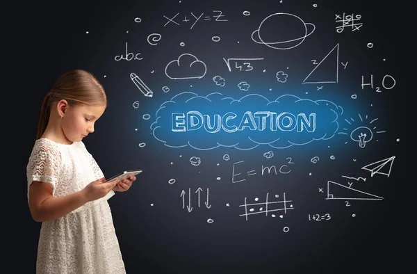 Little kid using on tablet with educational concept — Stock Photo, Image