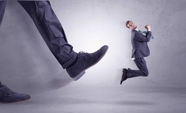 Foot kicking, businessman flying — Stock Photo, Image