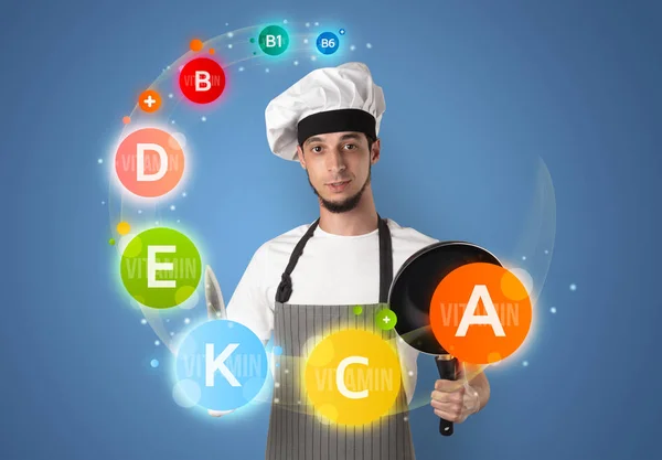 Handsome cook with vitamin concept — Stock Photo, Image