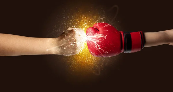 Fighting hands with orange explosion concept — Stock Photo, Image