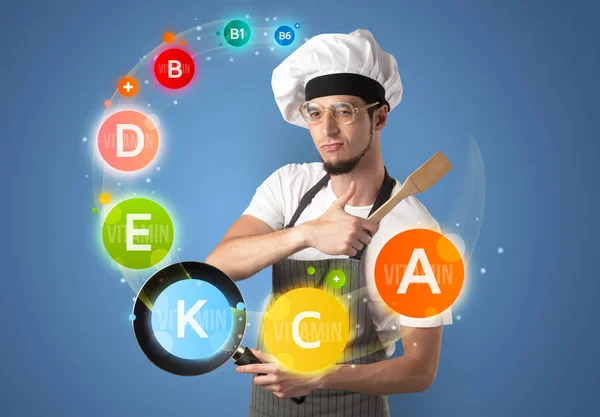 Handsome cook with vitamin concept — Stock Photo, Image