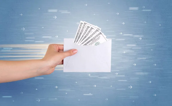 Hand holding envelope with arrows around — Stock Photo, Image