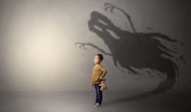 Scary ghost shadow behind kid clipart