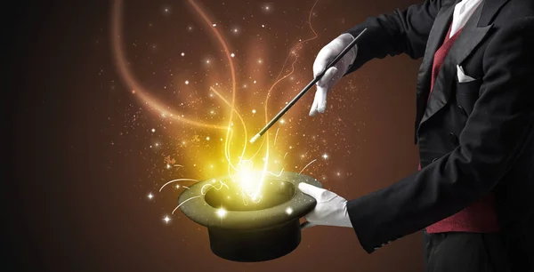 Magician hand conjure miracle from cylinder — Stock Photo, Image