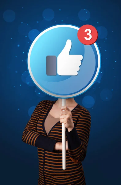 Woman holding facebook sign — Stock Photo, Image