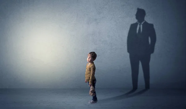 Little boy with businessman shadow — Stock Photo, Image