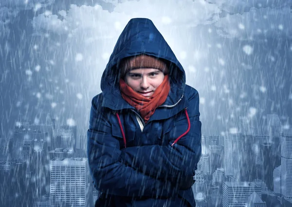 Boy freezing in cold weather with city concept — Stock Photo, Image