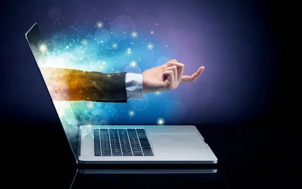 Hand coming out of a laptop — Stock Photo, Image