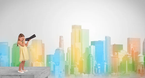 Cute little girl looking through spyglass to a big colourful city — Stock Photo, Image