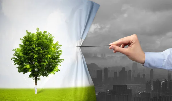 Hand pulling nature cityscape curtain to gray cityscape — Stock Photo, Image