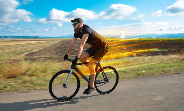 Young riding bicycle in nature — Stock Photo, Image