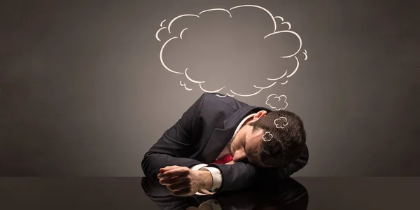 Businessman sleeping and dreaming at his workplace — Stock Photo, Image