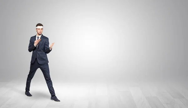 Businessman fighting in an empty space — Stock Photo, Image