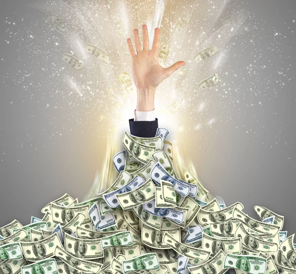 Hand bursting from a money heap — Stock Photo, Image