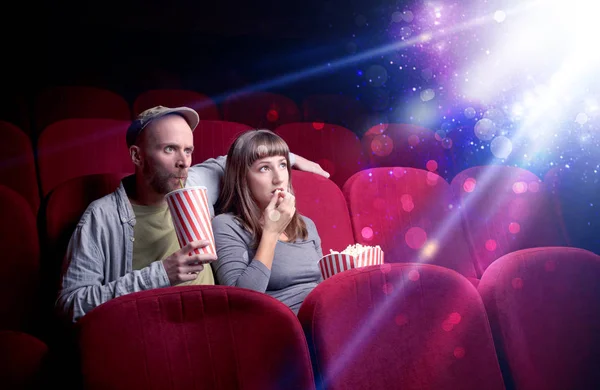 Romantic couple sitting at spectacle — Stock Photo, Image