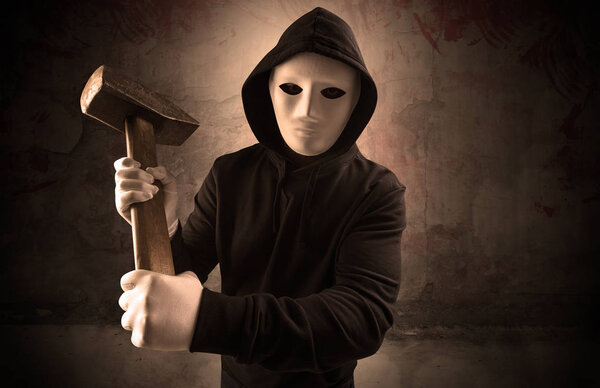 Armed assassin in an empty bloody room concept