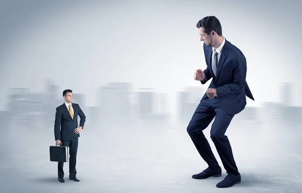 Giant businessman is  afraid of small executor — Stock Photo, Image