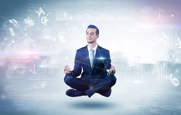 Businessman meditates with enlightenment concept — Stock Photo, Image