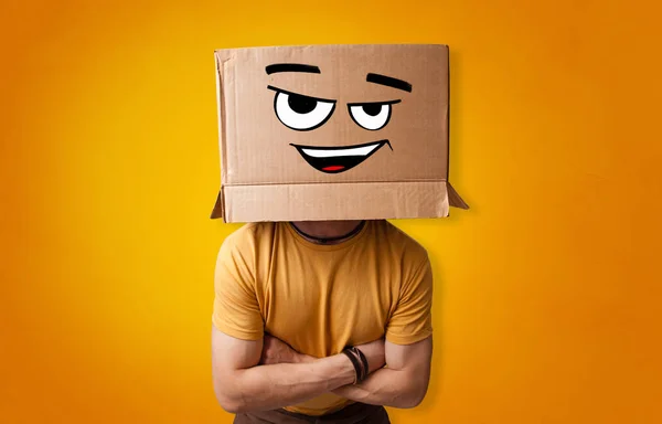 Young man  with cardboard box on his head — Stock Photo, Image