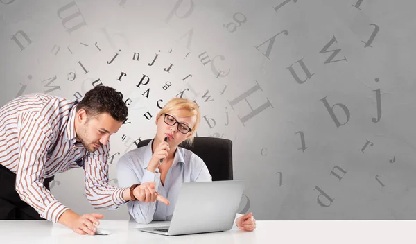 Business person sitting at desk with editorial concept — Stock Photo, Image