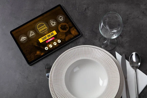 Online food order concept on laid table