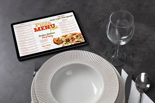 Online pizza menu with tableware concept — Stock Photo, Image