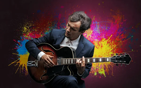 Composer with splotch and his guitar — Stock Photo, Image