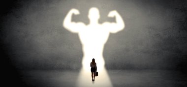 Woman standing in front of a strong hero vision clipart