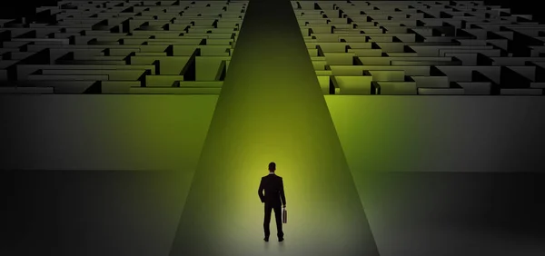 Businessman going straight on two dark mazes — Stock Photo, Image