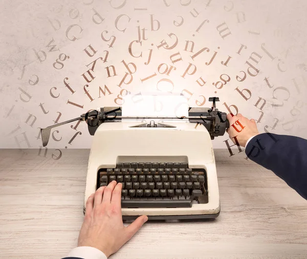 First person perspective elegant hand typing with flying letters concept — Stock Photo, Image