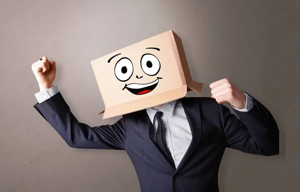 Young boy with happy cardboard box face — Stock Photo, Image