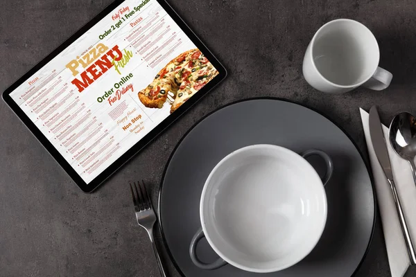 Online pizza menu with tableware concept — Stock Photo, Image