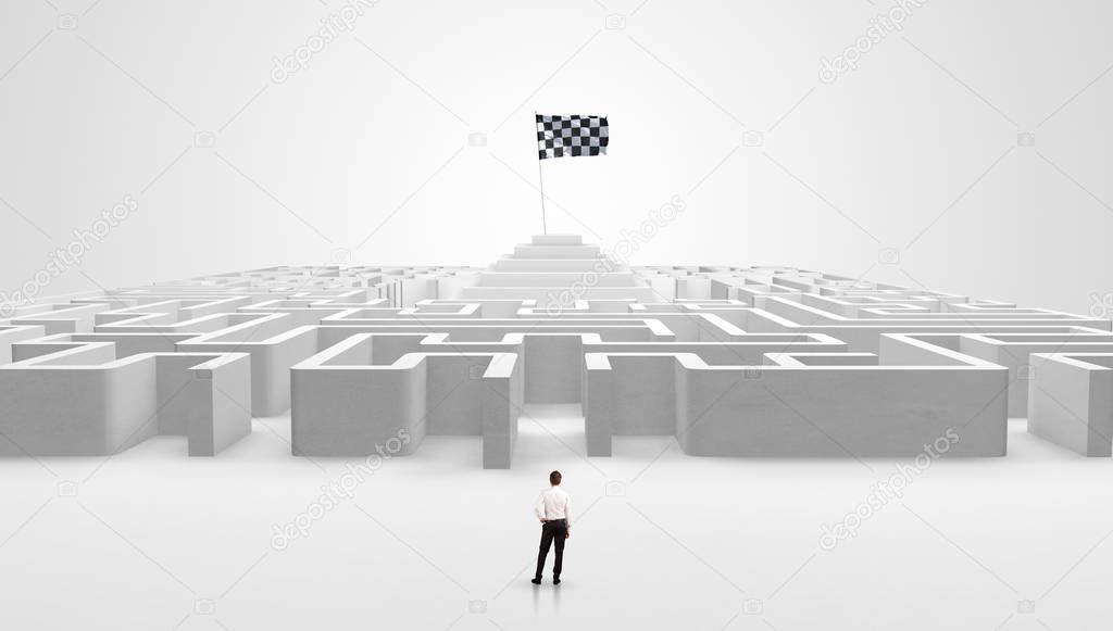 Man standing outside of a maze with pirate flag