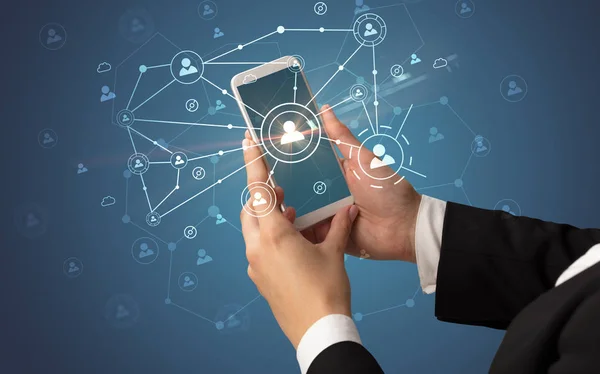 Hand using smartphone to connect people concept — Stock Photo, Image
