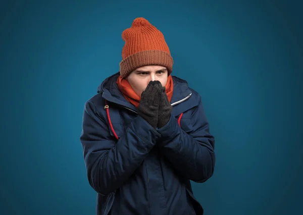 Handsome boy freezing in warm clothing — Stock Photo, Image