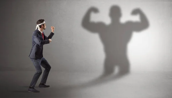 Businessman fighting with his bossy shadow — Stock Photo, Image