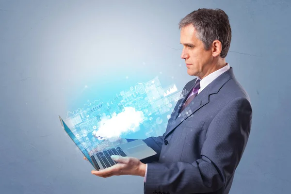 Man holding laptop with cloud based system notifications — Stock Photo, Image