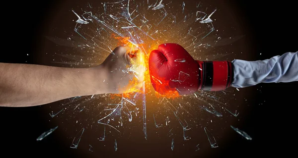 Fighting hands breaking glass — Stock Photo, Image