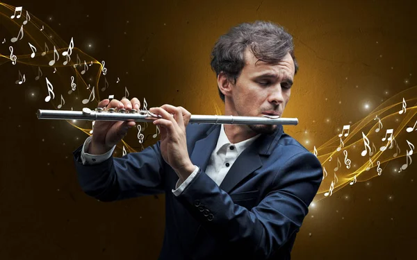 Lonely composer playing on flute — Stock Photo, Image