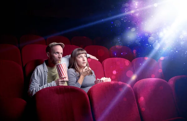 Romantic couple sitting at spectacle — Stock Photo, Image